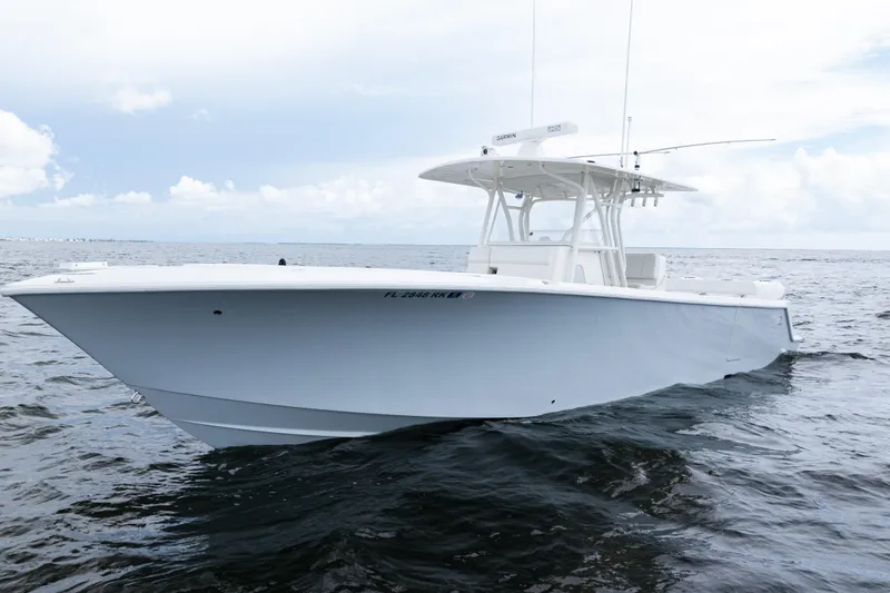 Slide: The Image of 2017 SeaVee 370z boat on open water under cloudy sky. - 45