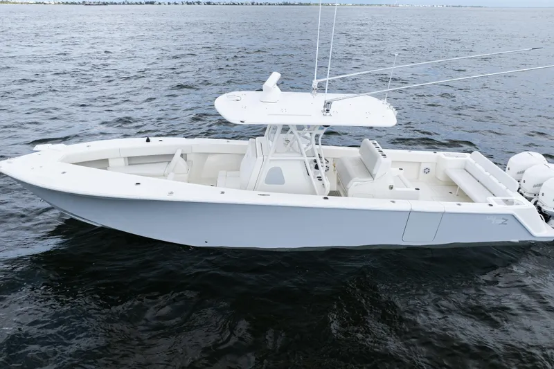 Slide: The Image of 2017 SeaVee 370z boat on open water, featuring sleek design and spacious deck. - 46