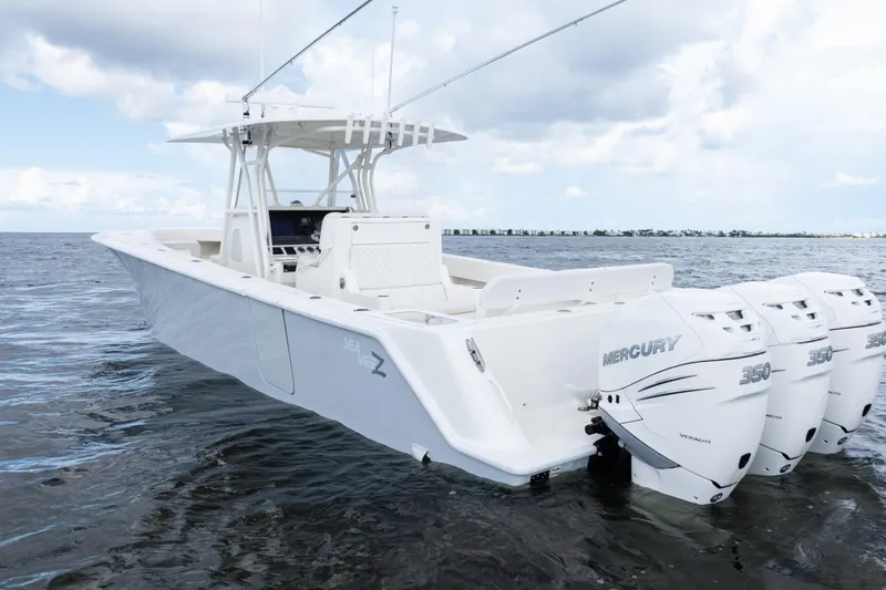 Slide: The Image of 2017 SeaVee 370z boat with triple Mercury 350 engines on open water. - 48