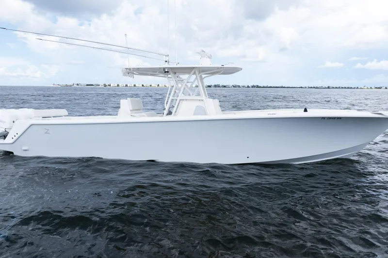 Slide: The Image of 2017 SeaVee 370z boat on open water under cloudy sky. - 49