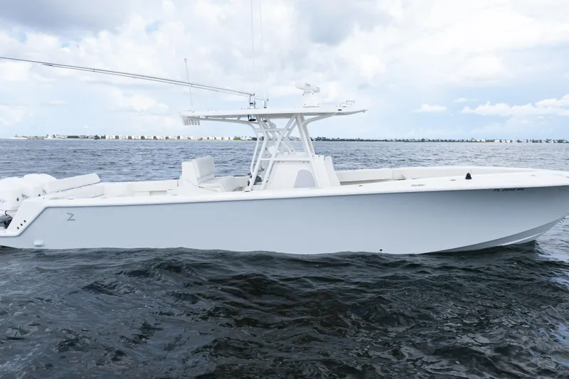 Slide: The Image of 2017 SeaVee 370z boat on open water under cloudy sky. - 50