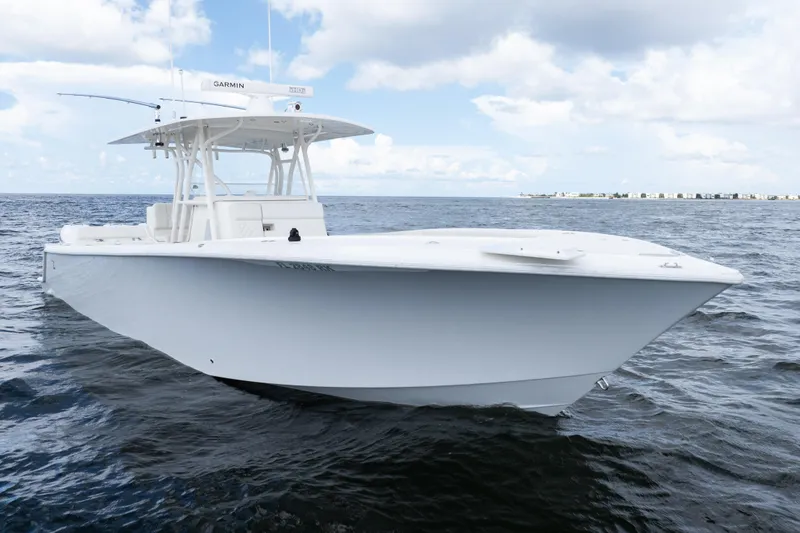 Slide: The Image of 2017 SeaVee 370z boat on open water under a partly cloudy sky. - 52