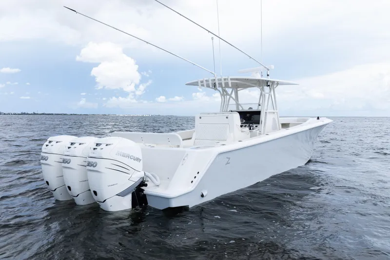 Slide: The Image of 2017 SeaVee 370z boat with triple Mercury 350 engines on open water. - 56