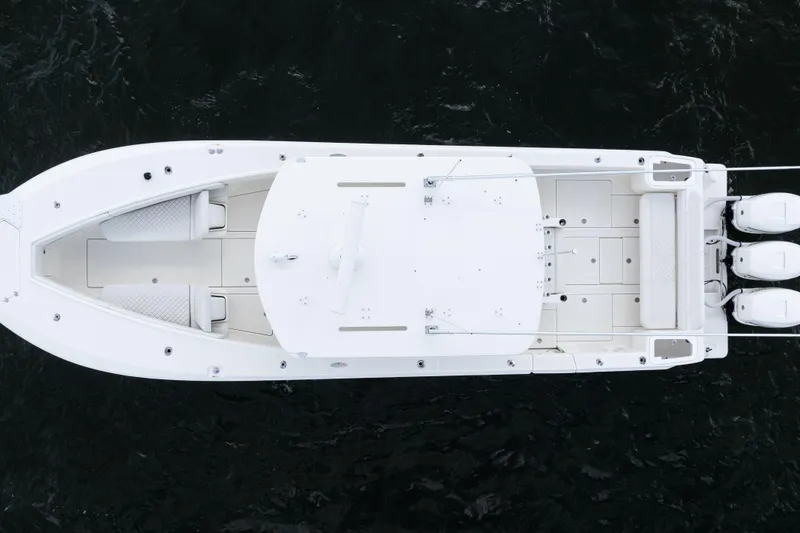 Slide: The Image of Top view of a 2017 SeaVee 370z boat with triple outboard engines. - 57