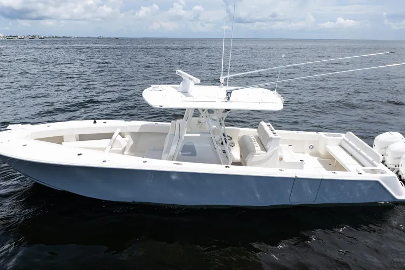 Slide: The Image of 2017 SeaVee 370z boat on open water, featuring sleek design and spacious deck. - 59