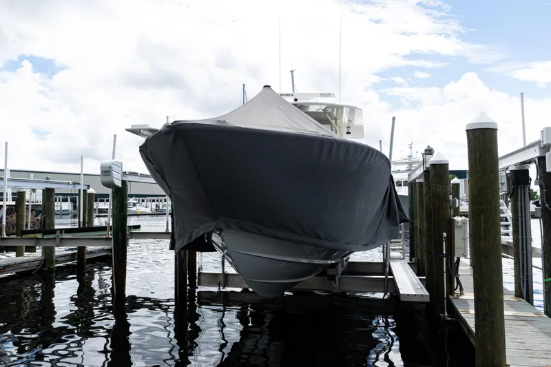 Slide: The Image of 2017 SeaVee 370z boat covered at dock, ready for storage. - 61