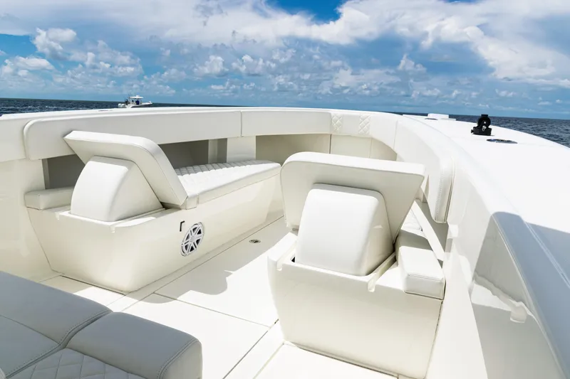 Slide: The Image of 2017 SeaVee 370z boat interior with white seating, ocean view, and blue sky. - 9