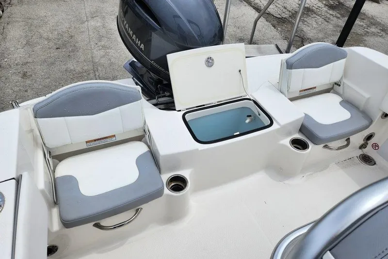 Slide: The Image of 2020 Robalo R180 Center Console boat interior with seating and storage compartments. - 3
