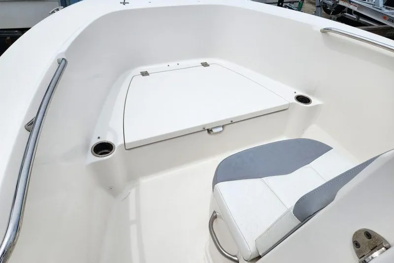 Slide: The Image of 2020 Robalo R180 Center Console boat interior with seating and storage compartment. - 4