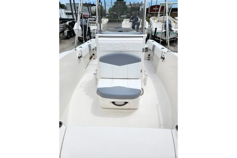 Slide: The Image of 2020 Robalo R180 Center Console boat interior with seating and console view. - 7