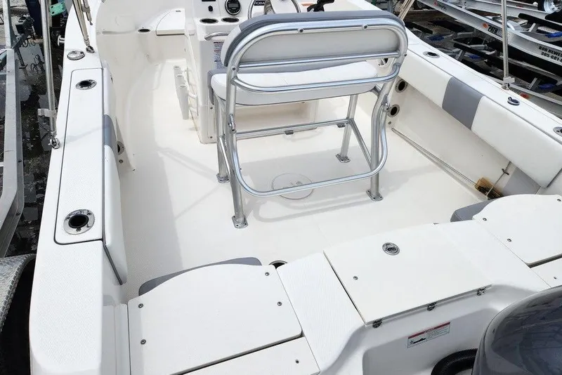 Slide: The Image of 2020 Robalo R180 Center Console boat interior with seating and console view. - 8
