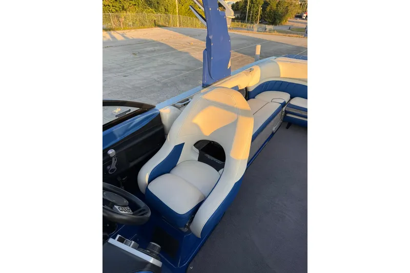 Slide: The Image of 2016 Malibu Wakesetter 25 LSV interior with blue and white seating. - 16
