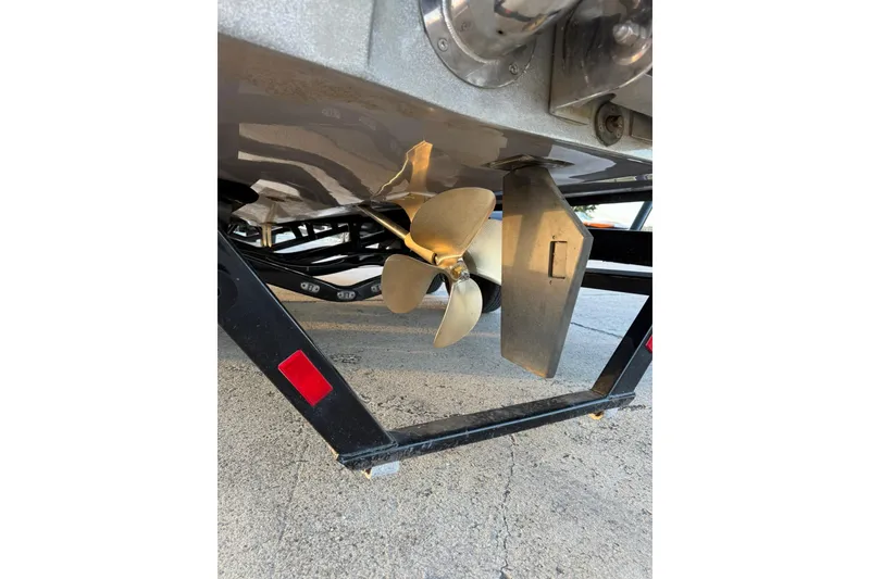 Slide: The Image of 2016 Malibu Wakesetter 25 LSV boat propeller and rudder detail. - 8