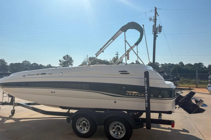 Slide: The Image of 1998 Chaparral Sunesta 210 boat on trailer under clear sky. - 3