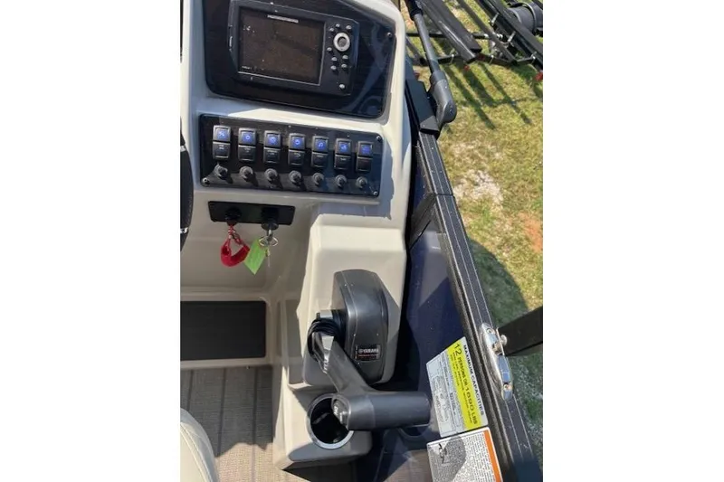 Slide: The Image of 2023 Sylvan Mirage X X3 boat dashboard with controls and navigation system. - 10