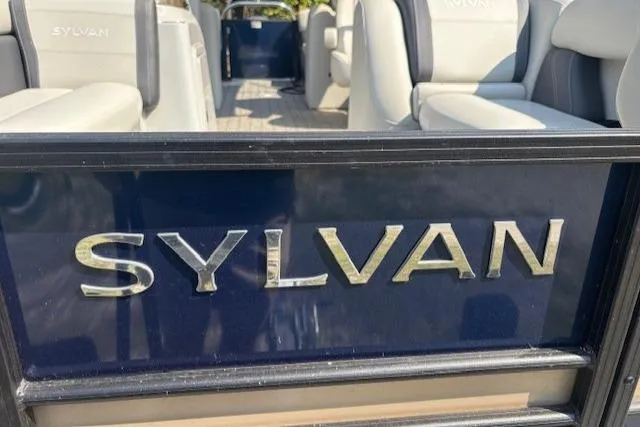 Slide: The Image of 2023 Sylvan Mirage X X3 boat interior with logo and seating. - 3