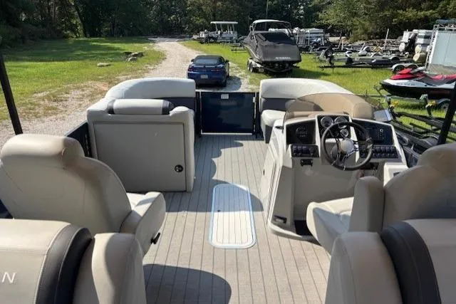 Slide: The Image of 2023 Sylvan Mirage X X3 pontoon boat interior with seating and steering console. - 5