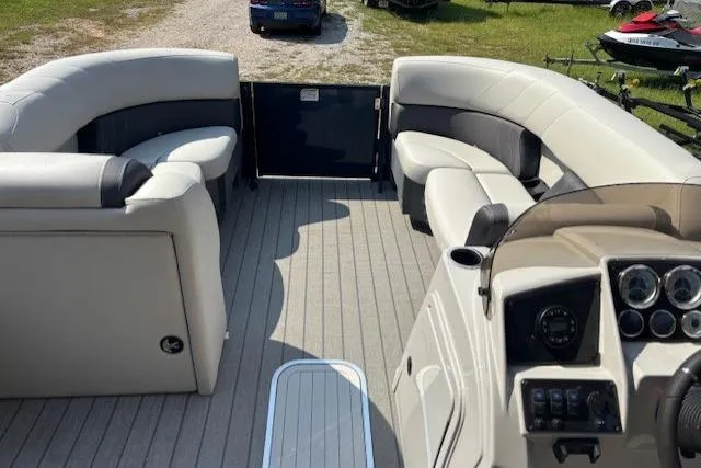 Slide: The Image of 2023 Sylvan Mirage X X3 pontoon boat interior with plush seating and modern dashboard. - 7