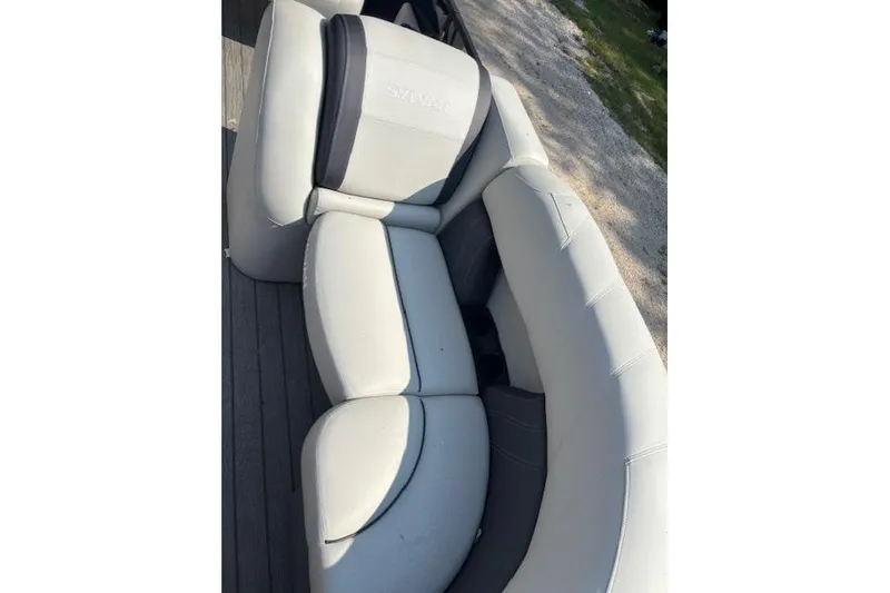 Slide: The Image of 2023 Sylvan Mirage X X3 boat seating with light gray upholstery. - 8