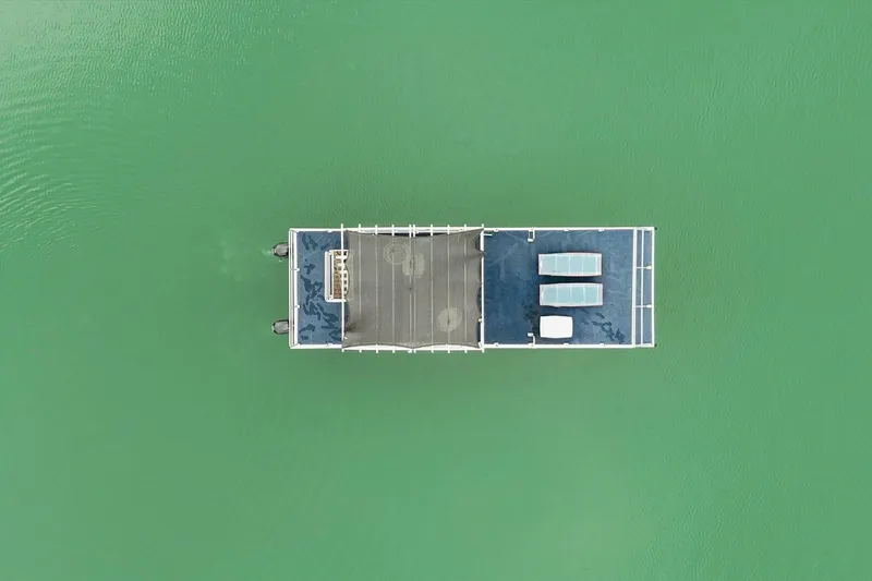 Slide: The Image of Aerial view of 2024 Gospel 39 boat on calm green water. - 24