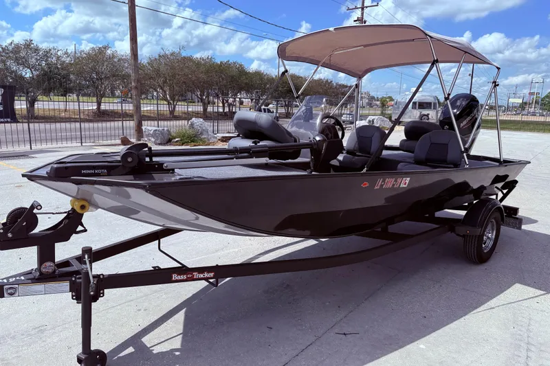 Slide: The Image of 2025 Bass Tracker Classic XL boat with Mercury engine on a trailer. - 4