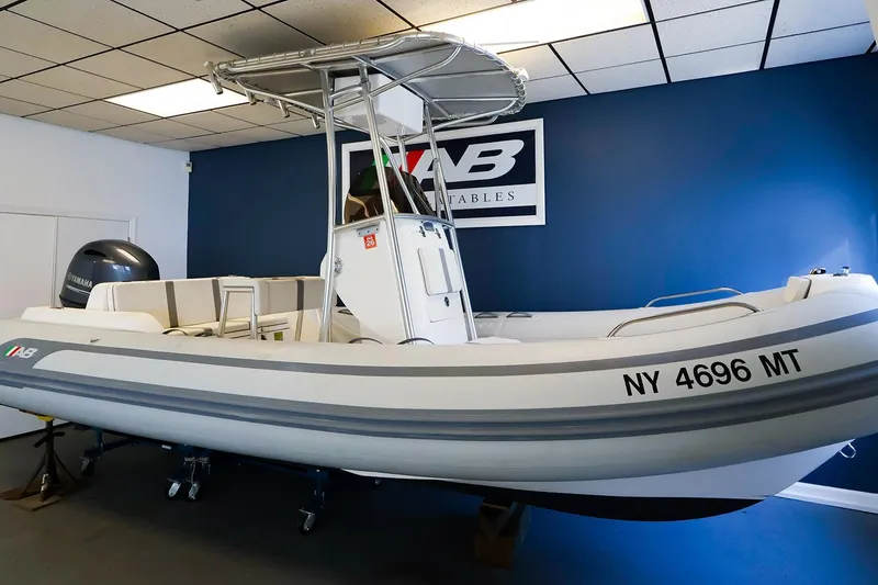 Slide: The Image of 2023 AB Inflatables Oceanus 19 VST boat displayed indoors with Yamaha engine. - 0