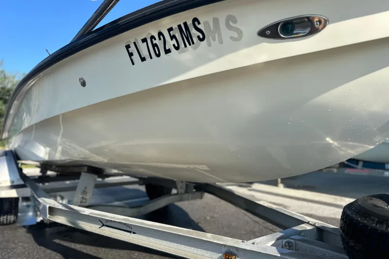 Slide: The Image of 2004 Hells Bay 18 Marquesa boat on trailer, close-up view. - 11