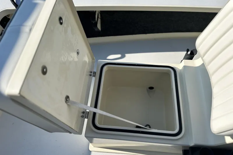Slide: The Image of Open storage compartment on a 2004 Hells Bay 18 Marquesa boat. - 13