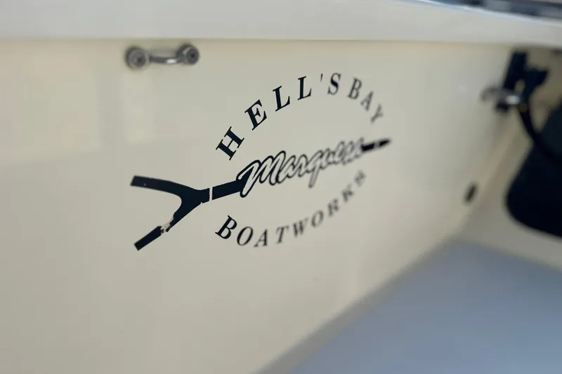 Slide: The Image of 2004 Hells Bay 18 Marquesa boat logo on side panel. - 16