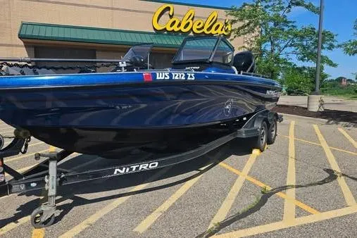 Slide: The Image of 2016 Nitro ZV21 Pro boat parked outside Cabela's store. - 2