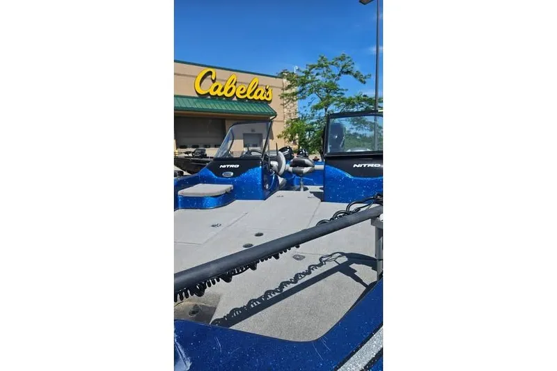 Slide: The Image of 2016 Nitro ZV21 Pro boat displayed outside Cabela's store. - 3