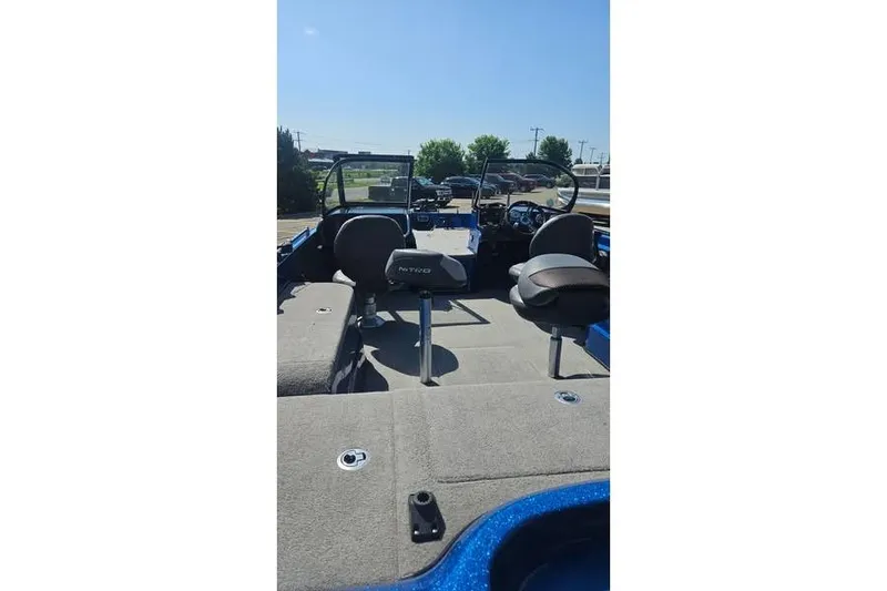 Slide: The Image of 2016 Nitro ZV21 Pro boat interior with seating and steering console. - 4