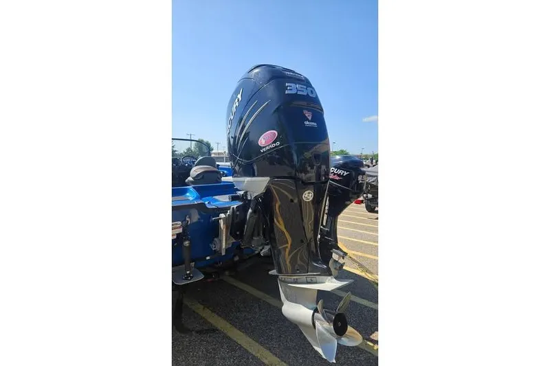 Slide: The Image of Outboard motor on a 2016 Nitro ZV21 Pro boat in a parking lot. - 5