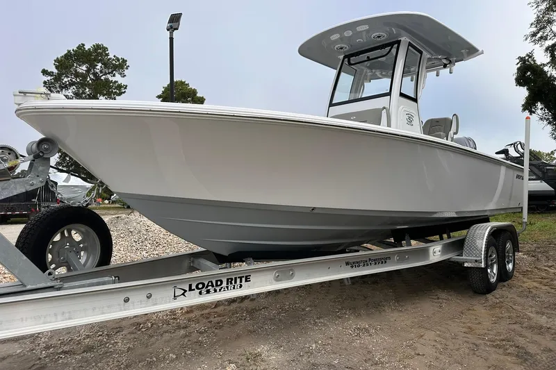 The Image of 2025 Sportsman Masters 247OE Bay Boat on trailer, side view. - 0