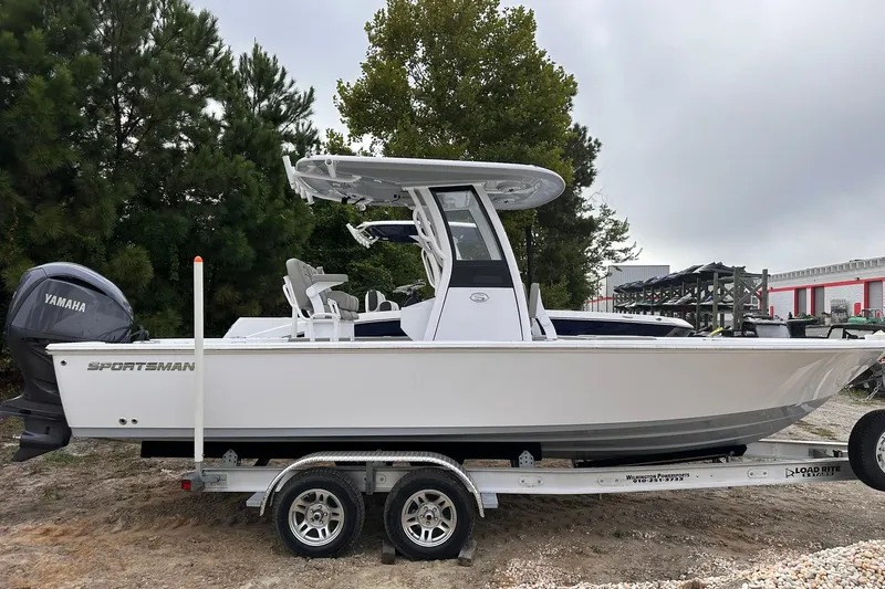 Slide: The Image of 2025 Sportsman Masters 247OE Bay Boat on trailer, side view, outdoors. - 1