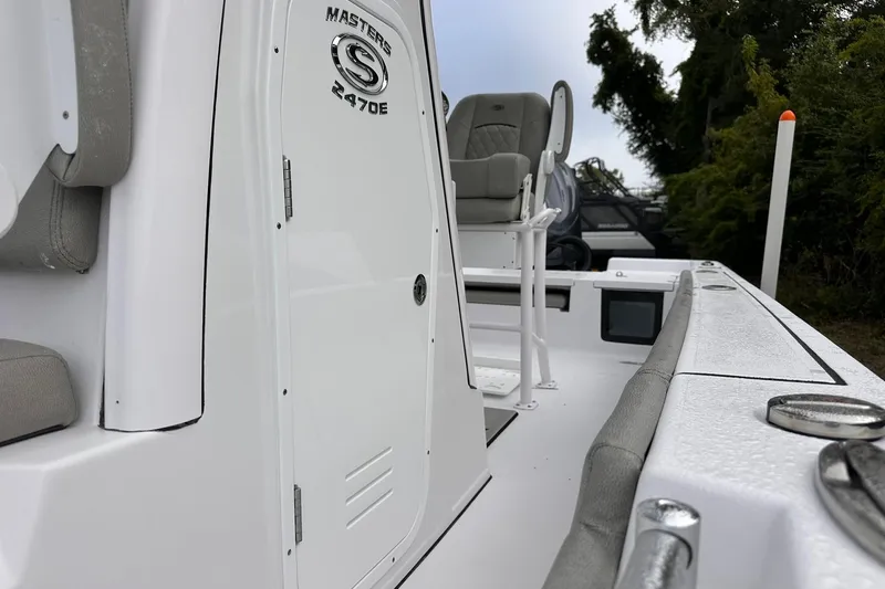 Slide: The Image of 2025 Sportsman Masters 247OE Bay Boat, sleek design, white exterior, comfortable seating. - 10