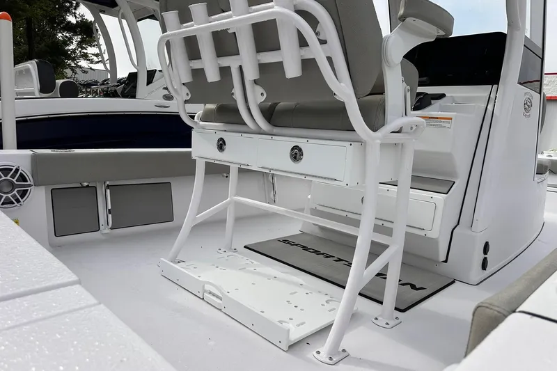 Slide: The Image of 2025 Sportsman Masters 247OE Bay Boat interior with seating and storage compartments. - 13