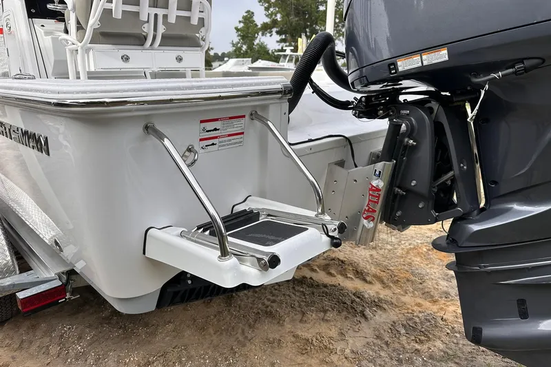 Slide: The Image of 2025 Sportsman Masters 247OE Bay Boat with outboard motor and swim platform. - 14
