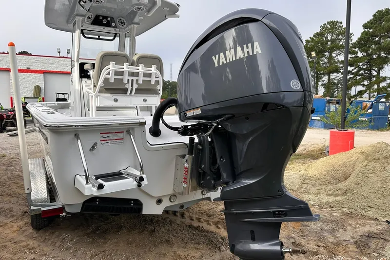 Slide: The Image of 2025 Sportsman Masters 247OE Bay Boat with Yamaha outboard motor, rear view. - 15