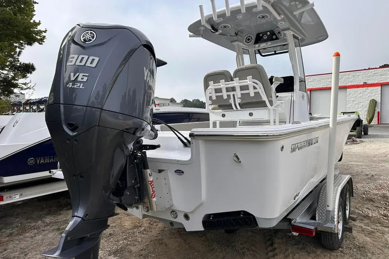 Slide: The Image of 2025 Sportsman Masters 247OE Bay Boat with Yamaha 300 V6 engine, parked on trailer. - 17