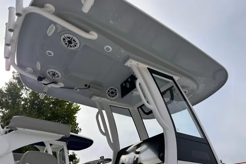 Slide: The Image of 2025 Sportsman Masters 247OE Bay Boat T-top with speakers and rod holders. - 20