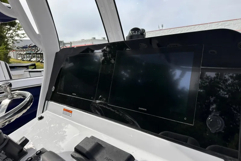 Slide: The Image of 2025 Sportsman Masters 247OE Bay Boat dashboard with dual Garmin displays. - 22