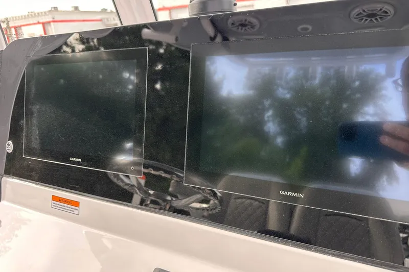 Slide: The Image of 2025 Sportsman Masters 247OE Bay Boat dashboard with dual Garmin displays. - 24