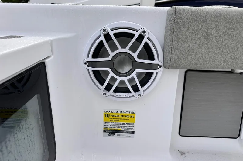 Slide: The Image of 2025 Sportsman Masters 247OE Bay Boat speaker and capacity label detail. - 28