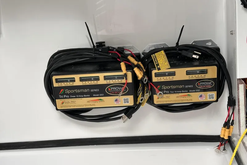 Slide: The Image of Battery chargers on a 2025 Sportsman Masters 247OE Bay Boat, featuring ProVolt systems. - 30