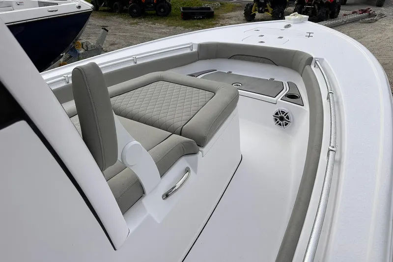 Slide: The Image of 2025 Sportsman Masters 247OE Bay Boat interior with cushioned seating and sleek design. - 33