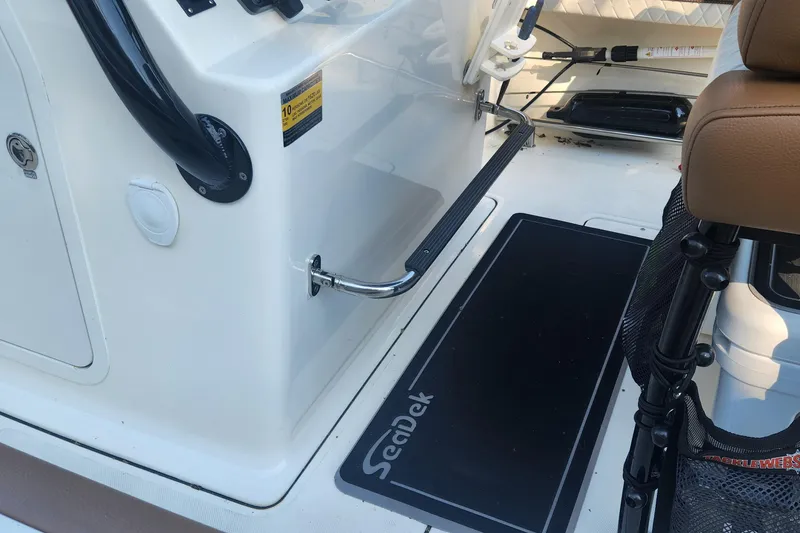 Slide: The Image of Interior of 2022 Pioneer 222 Islander boat with SeaDek flooring and seating. - 15