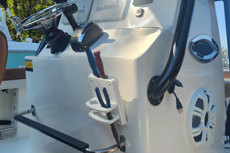 Slide: The Image of 2022 Pioneer 222 Islander boat console with Garmin electronics and steering wheel. - 16