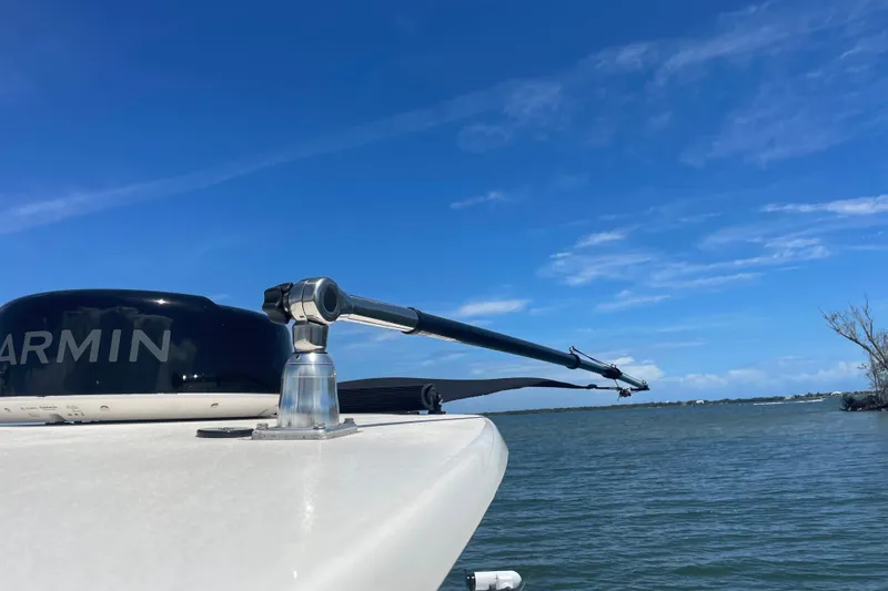 Slide: The Image of Bow of 2022 Pioneer 222 Islander boat with Garmin equipment, under clear blue sky. - 18