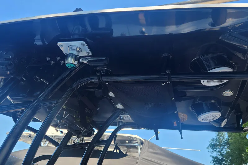 Slide: The Image of 2022 Pioneer 222 Islander boat's T-top with speakers and rod holders. - 19